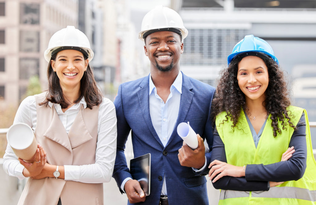 Three-young-engineers-standing