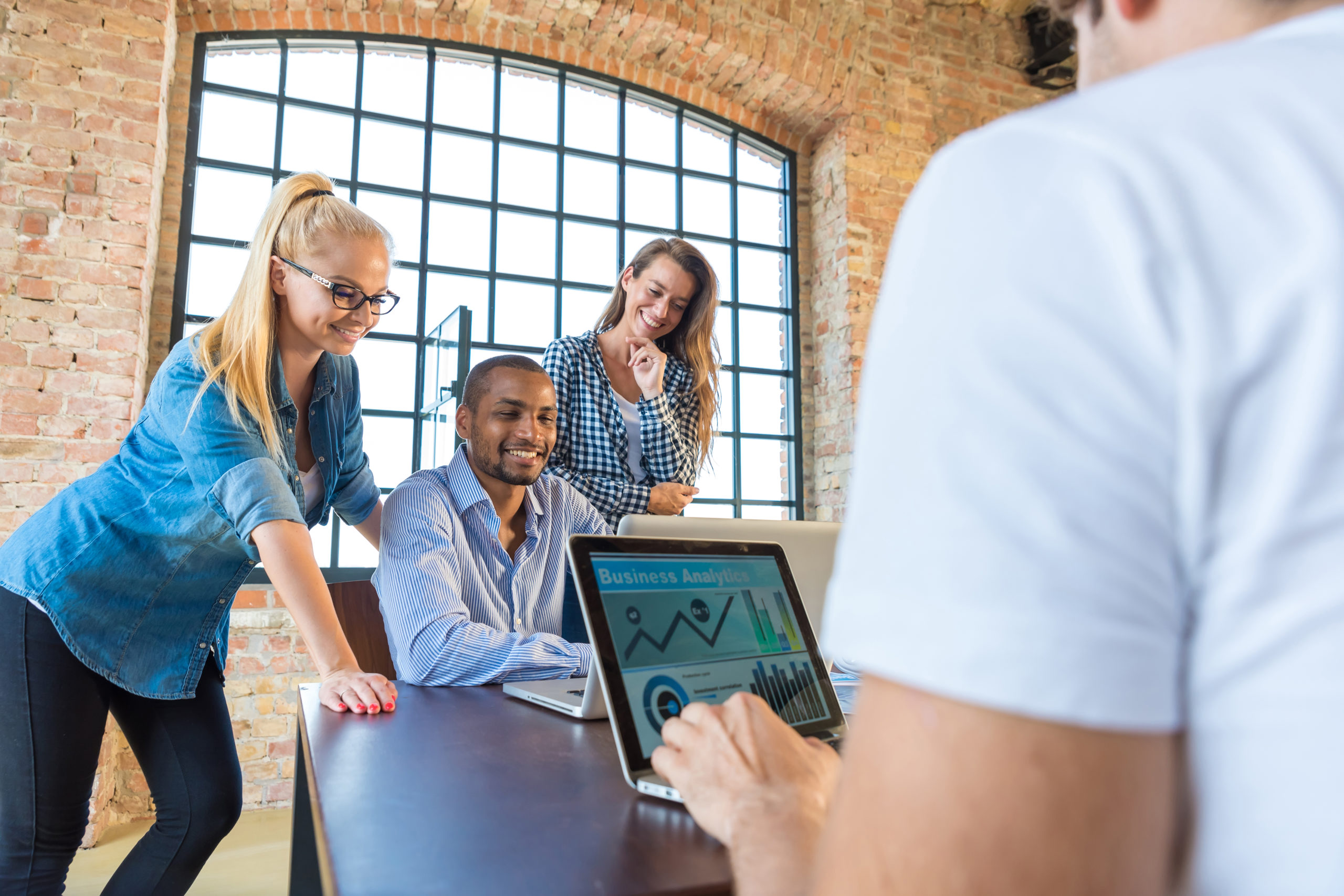 Young business people in office preparing foundation of a start-up company.