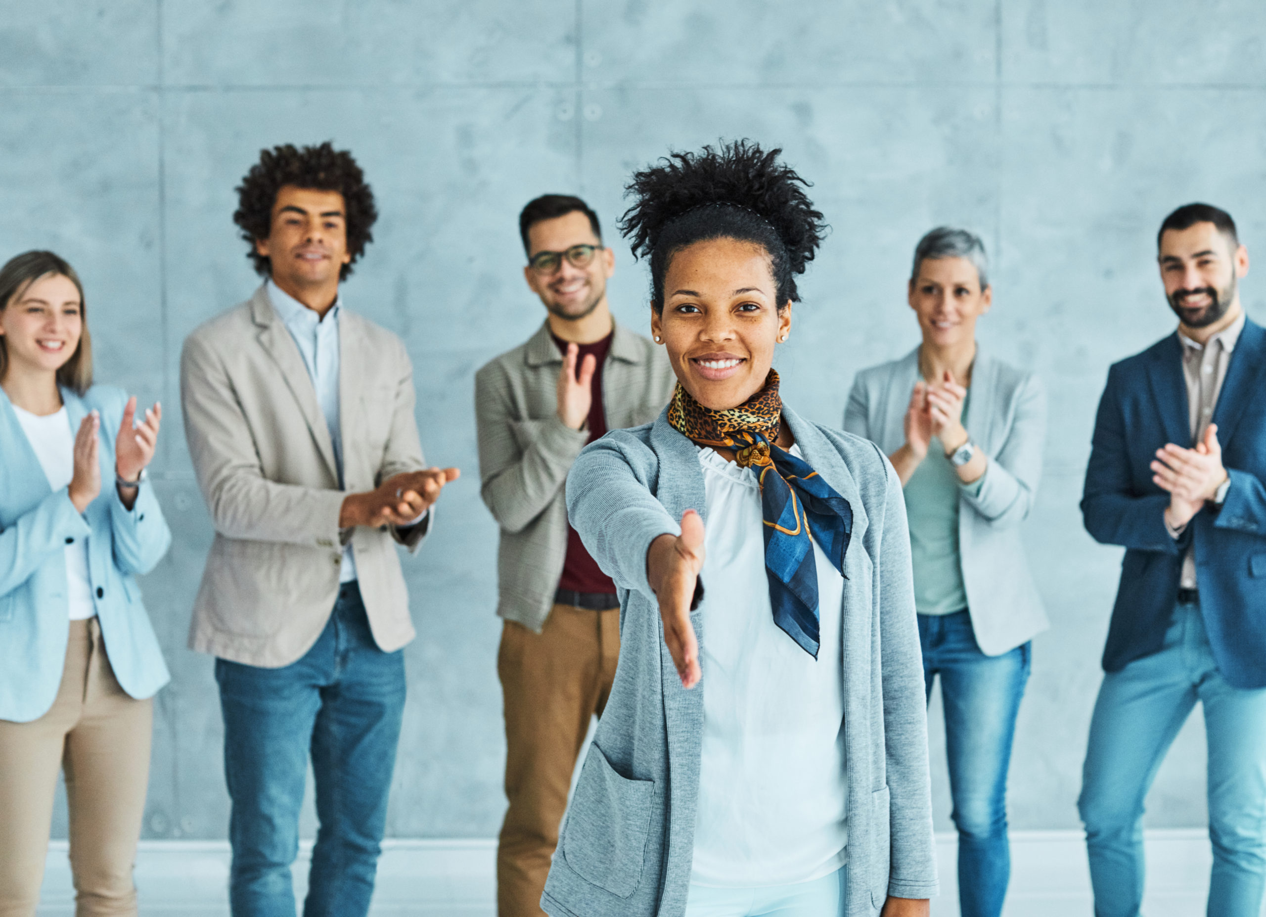 Young business people meeting in office with a handshake.