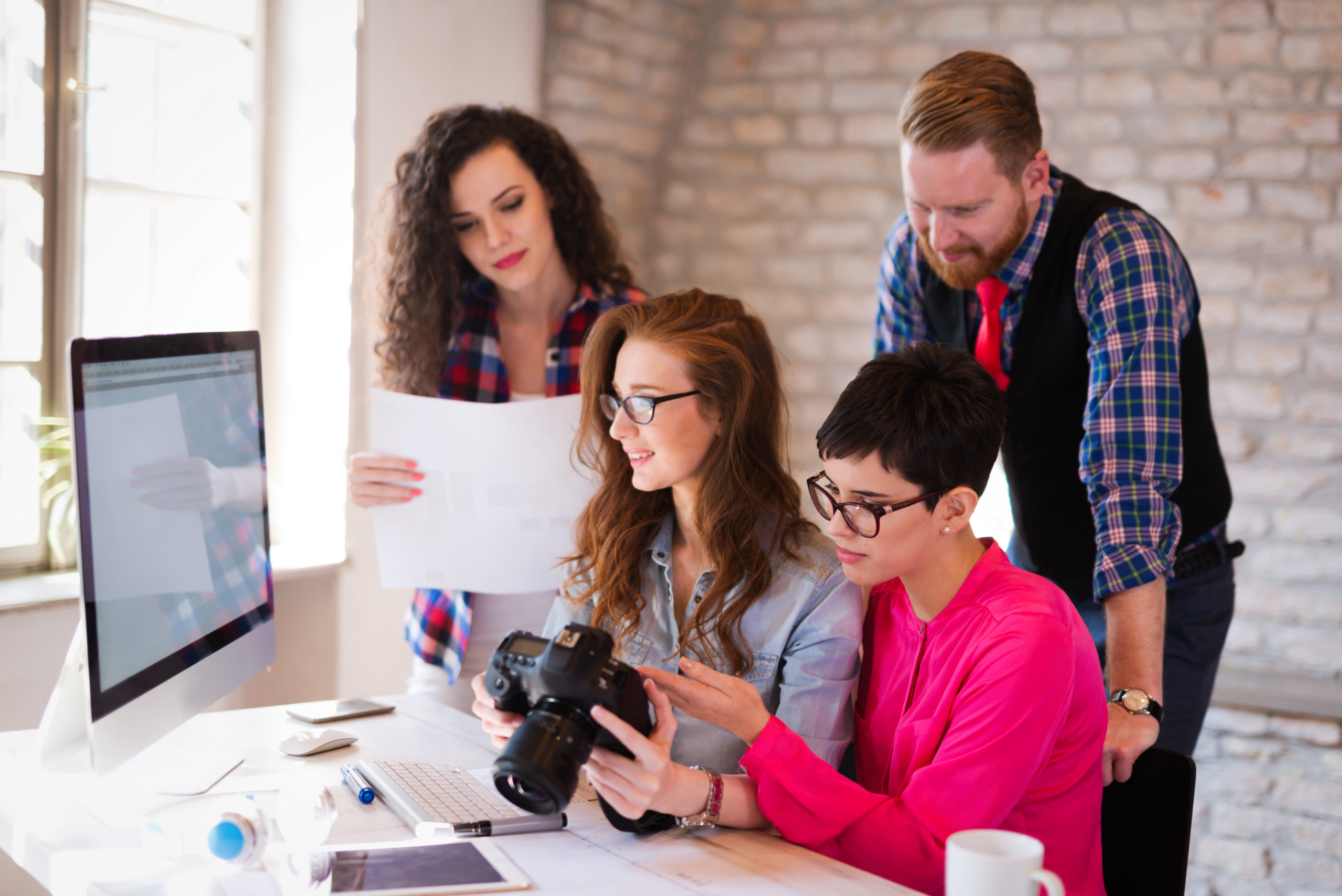 Picture of young architects discussing in office