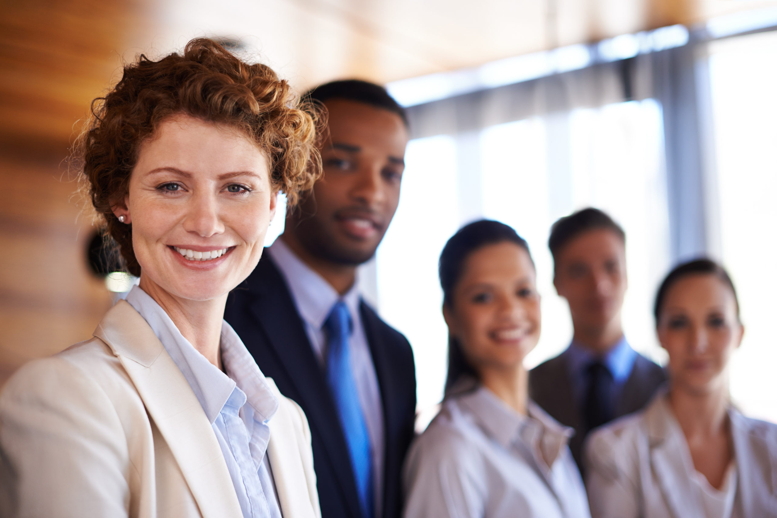 Attractive businesswoman with her colleagues
