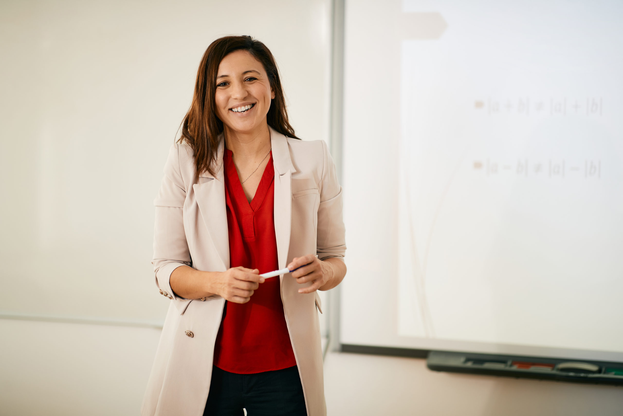 Portrait of happy professor teaching
