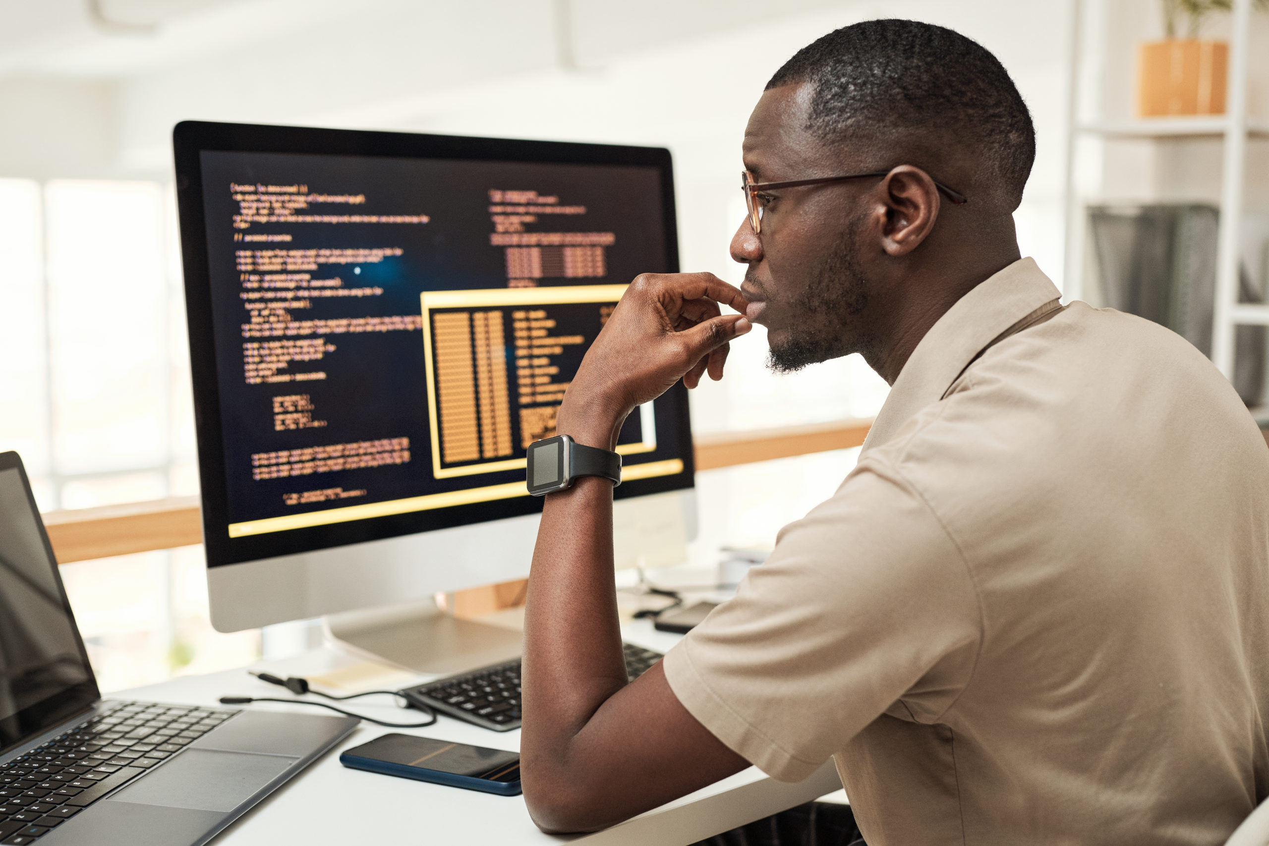 Software Engineer Reading Programming Code